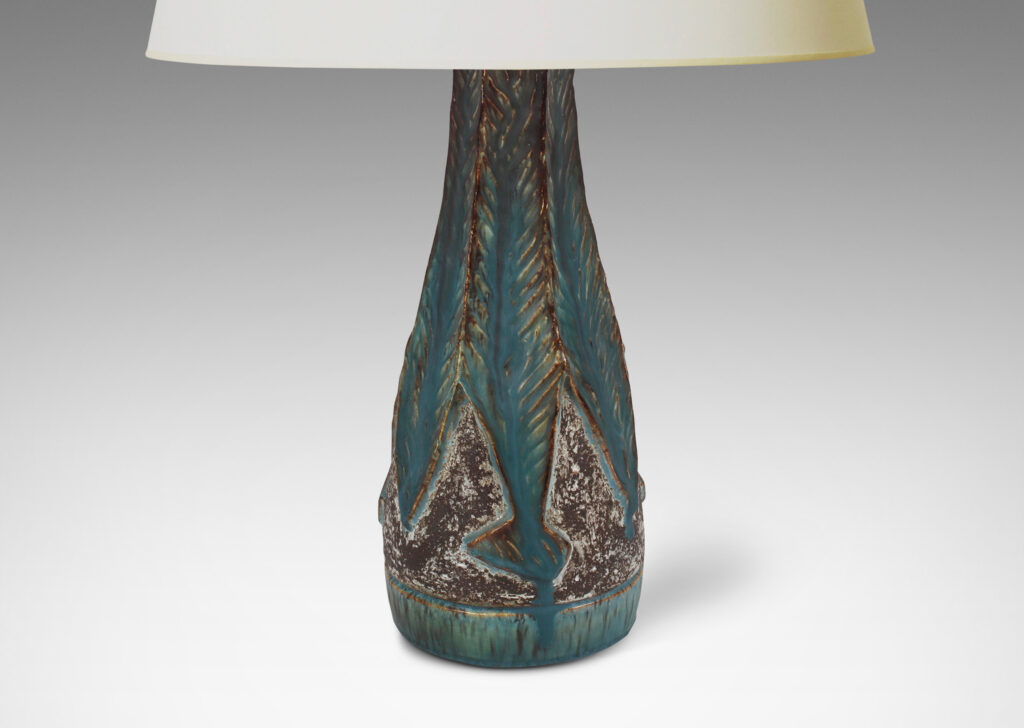 Gallery BAC aceted conical form, with robustly carved leafy forms glazed incornflower blue