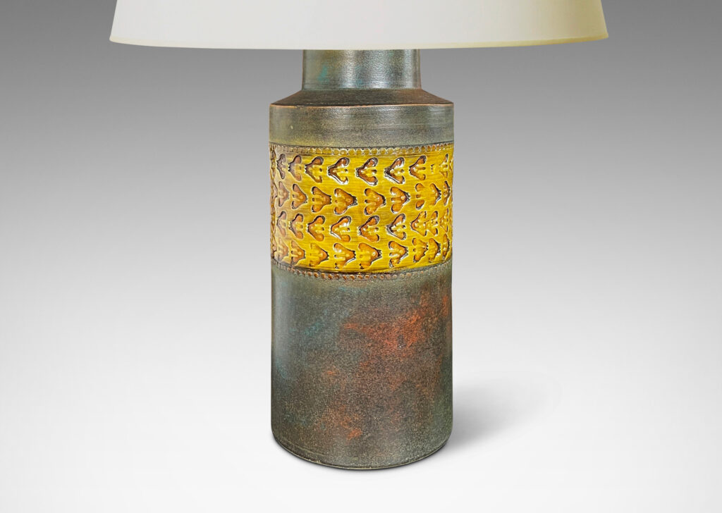 Gallery BAC canister form in matte green-brown, with wide bands with impressed ornaments glazed in a gloss golden tone