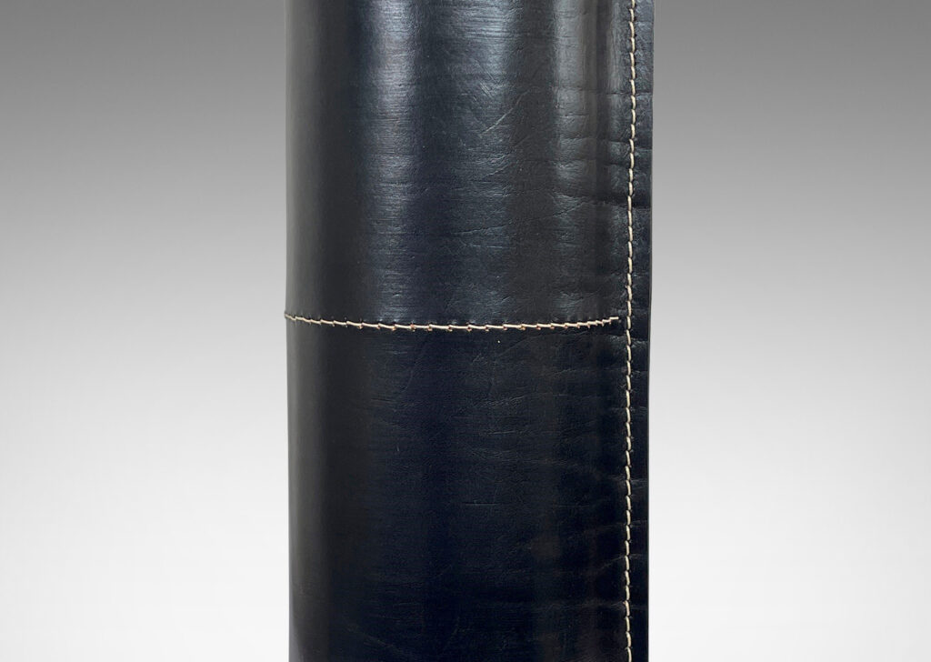 Gallery BAC column form covered in stitched black leather