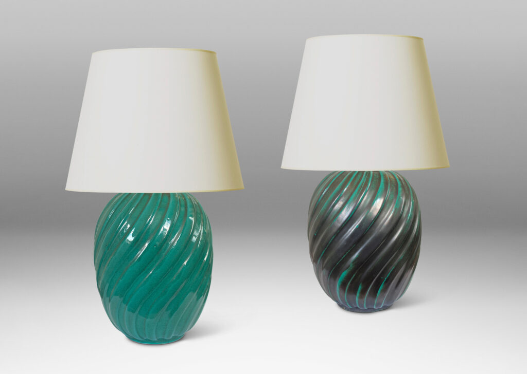 Gallery BAC fluted upright oval forms with vertical fluting; ceramic with a deep teal copper oxide glaze