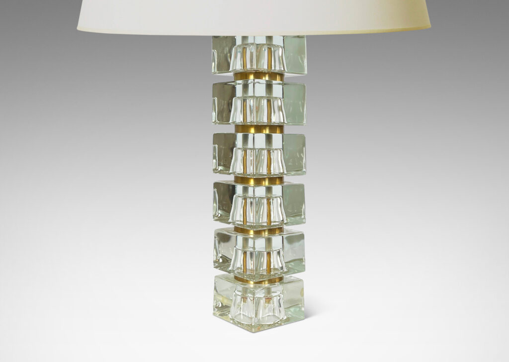 Gallery BAC consisting of stacked squared clear glass blocks with round brass separators, cast glass with brass