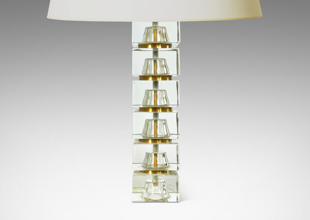 Gallery BAC consisting of stacked squared clear glass blocks with round brass separators, cast glass with brass