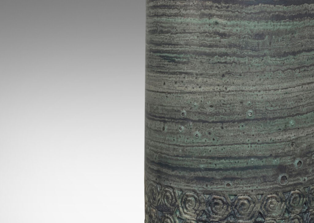 Gallery BAC columnar forms decorated with relief bands of rosette motifs and a glazed striae faux-bois finish in muted turquoise and gray