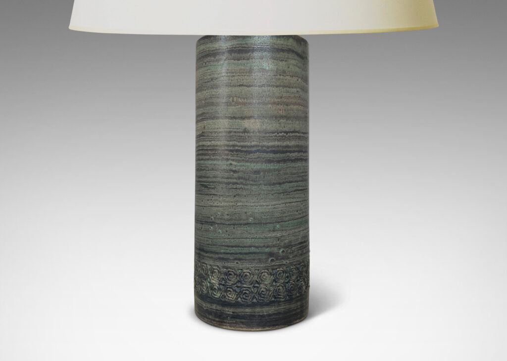 Gallery BAC columnar forms decorated with relief bands of rosette motifs and a glazed striae faux-bois finish in muted turquoise and gray