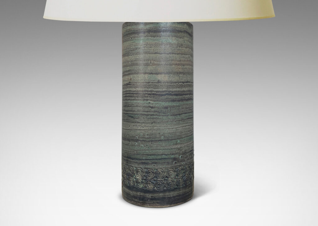 Gallery BAC columnar forms decorated with relief bands of rosette motifs and a glazed striae faux-bois finish in muted turquoise and gray