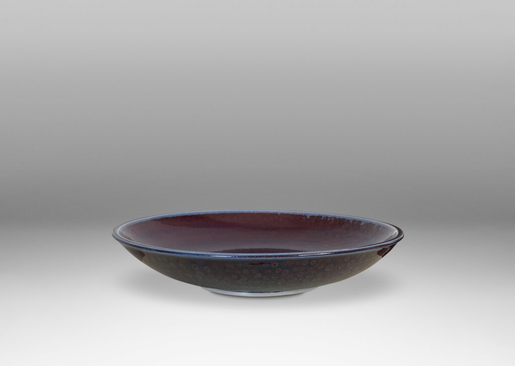 Gallery BAC curved silhouette glazed in a magnificent oxblood tone with touches of light purple