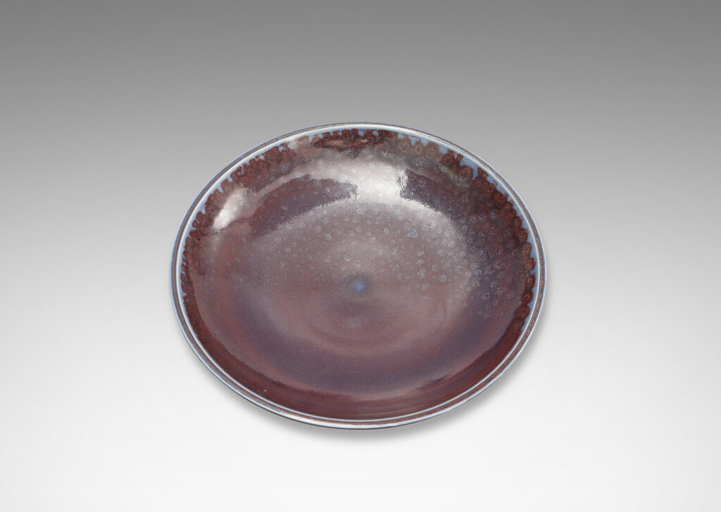 Gallery BAC curved silhouette glazed in a magnificent oxblood tone with touches of light purple