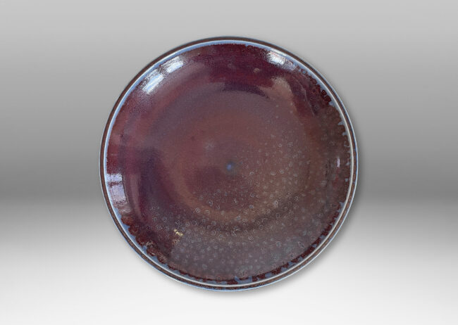 Gallery BAC curved silhouette glazed in a magnificent oxblood tone with touches of light purple