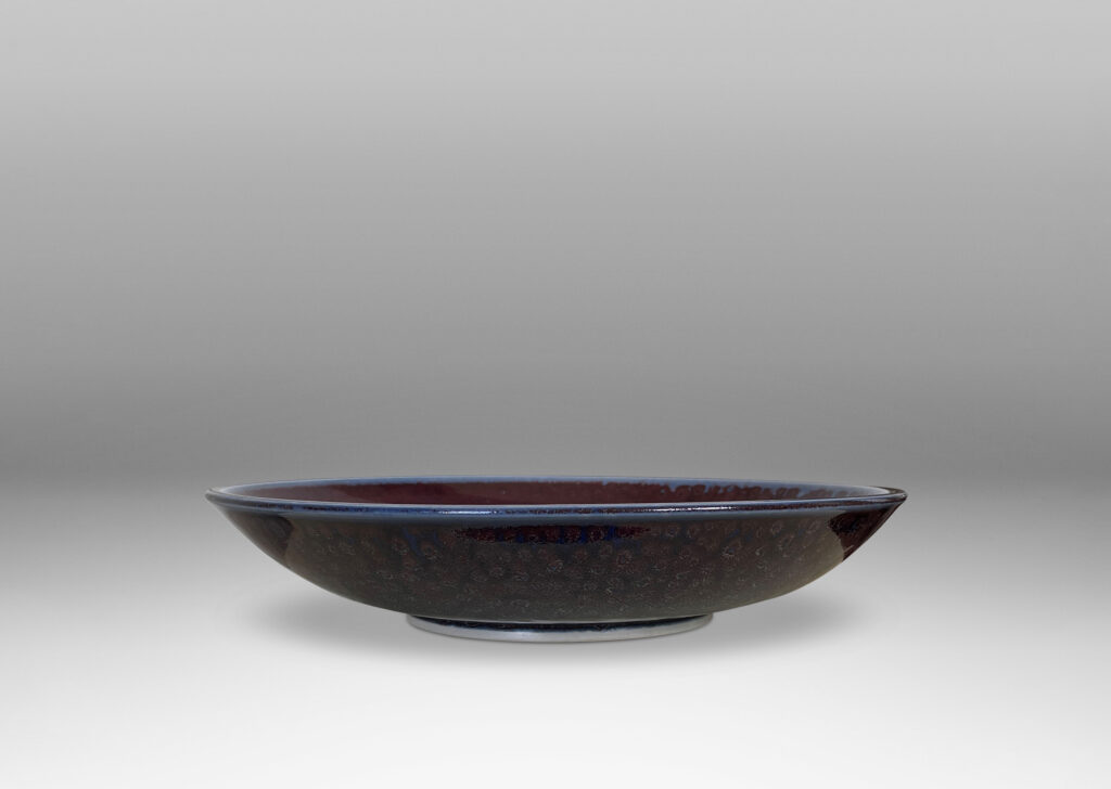 Gallery BAC curved silhouette glazed in a magnificent oxblood tone with touches of light purple