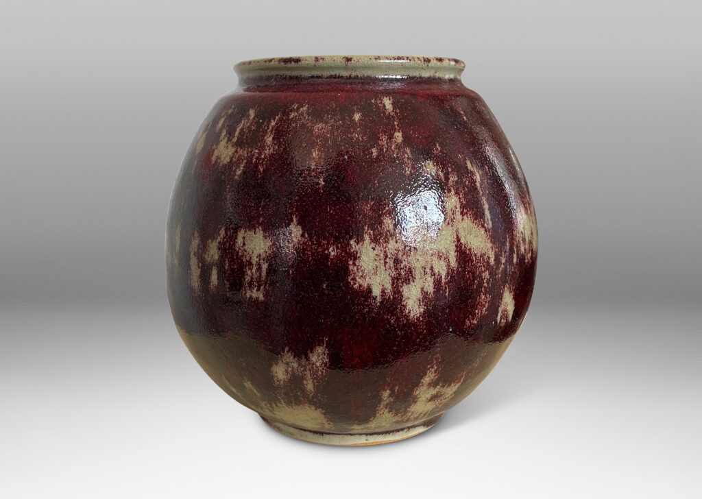 Gallery BAC modeled ovoid form, glazed in a saturated oxblood with pale gray accents