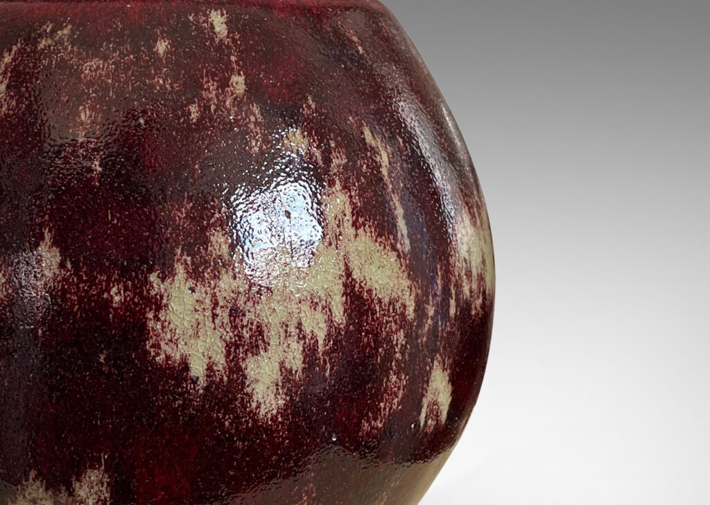 Gallery BAC modeled ovoid form, glazed in a saturated oxblood with pale gray accents