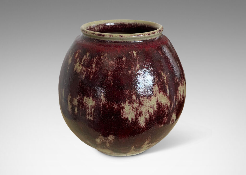 Gallery BAC modeled ovoid form, glazed in a saturated oxblood with pale gray accents