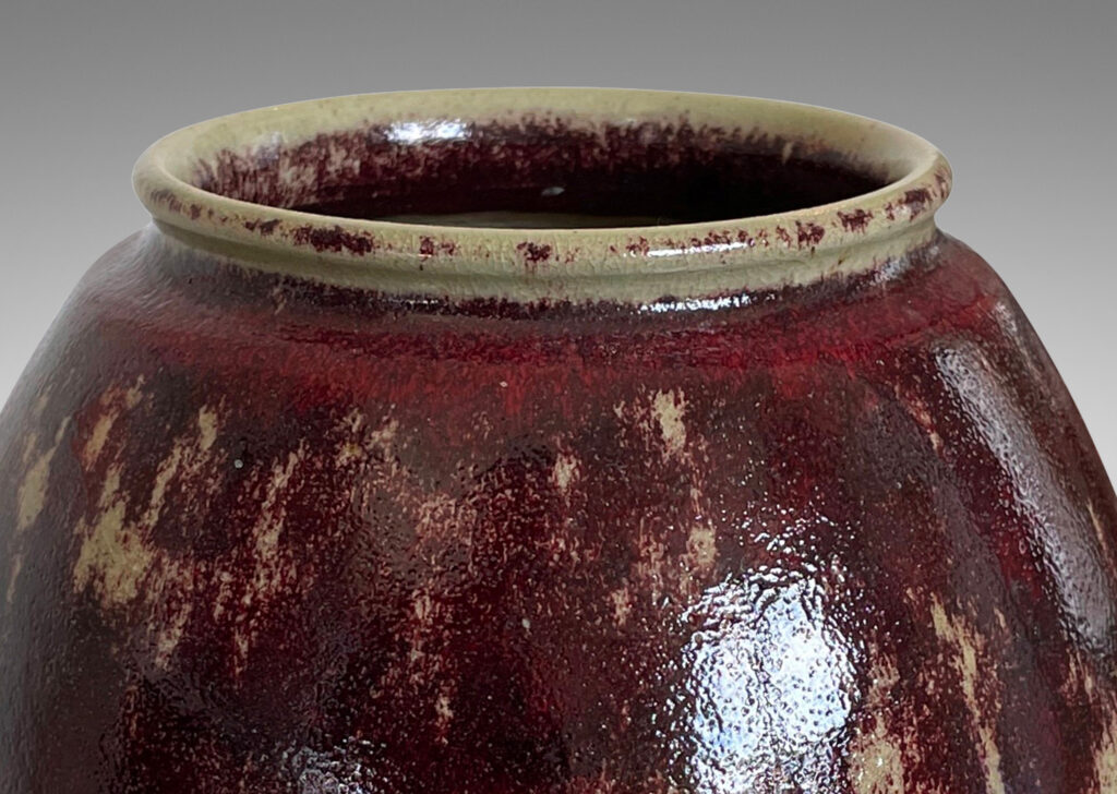 Gallery BAC modeled ovoid form, glazed in a saturated oxblood with pale gray accents