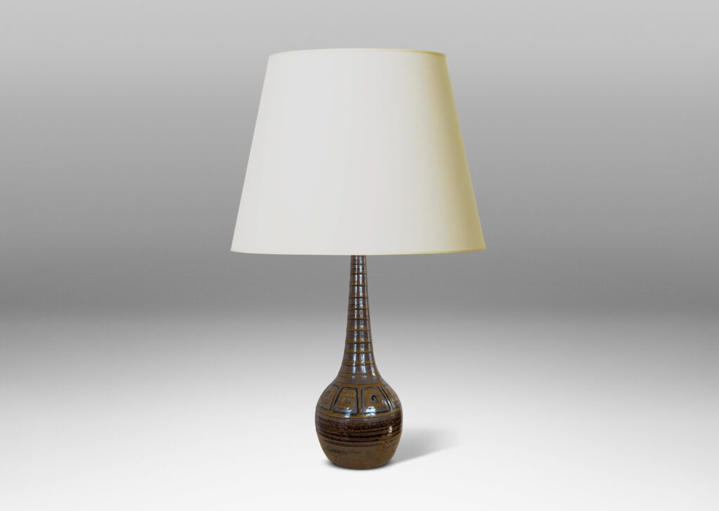 Gallery BAC bulbous form with tall conical neck, glazed in brown luster tones, with pattern of stripes and concentric square motifs