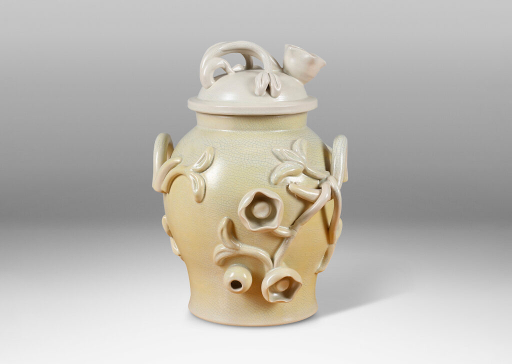 Gallery BAC swelling form with high-relief applied floral reliefs and dome lid, glazed in ivory and lemon yellow