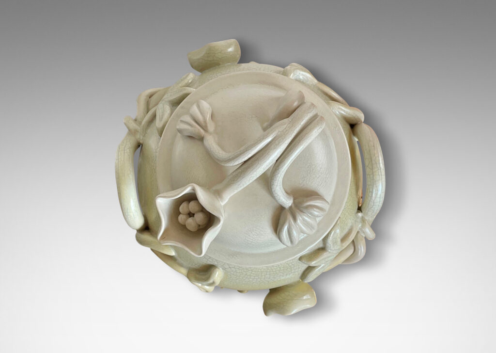 Gallery BAC swelling form with high-relief applied floral reliefs and dome lid, glazed in ivory and lemon yellow