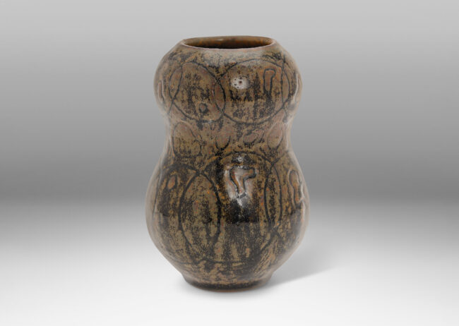 Gallery BAC double gourd form ornamented with a carved intersecting circle design, glazed in black and lustrous brown tones