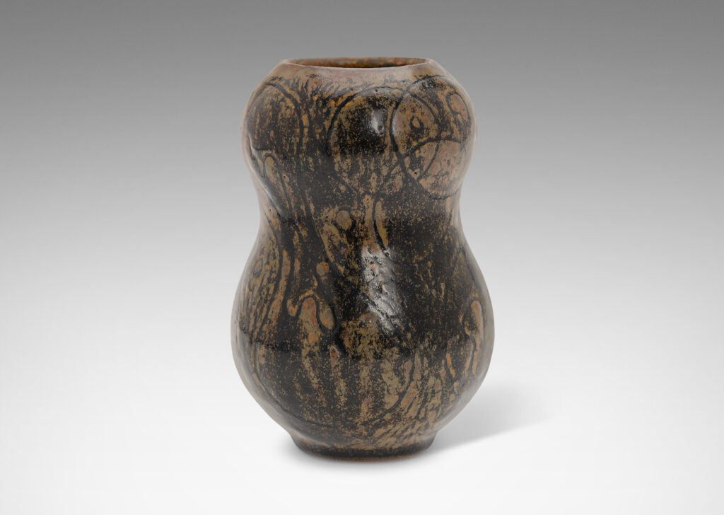 Gallery BAC double gourd form ornamented with a carved intersecting circle design, glazed in black and lustrous brown tones