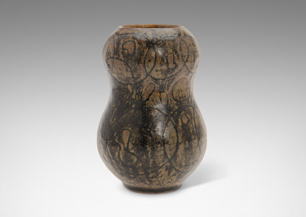 Gallery BAC double gourd form ornamented with a carved intersecting circle design, glazed in black and lustrous brown tones