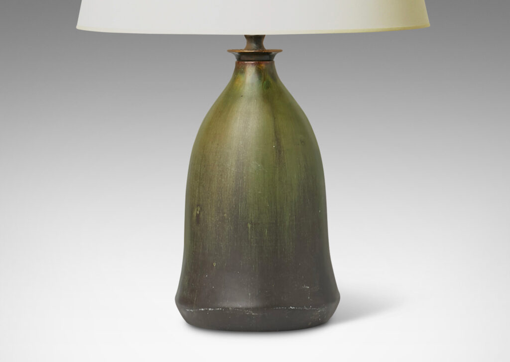 Gallery BAC flaring bell form with a magnificently executed flowing olive and dark green glaze and bronze mount with filigree