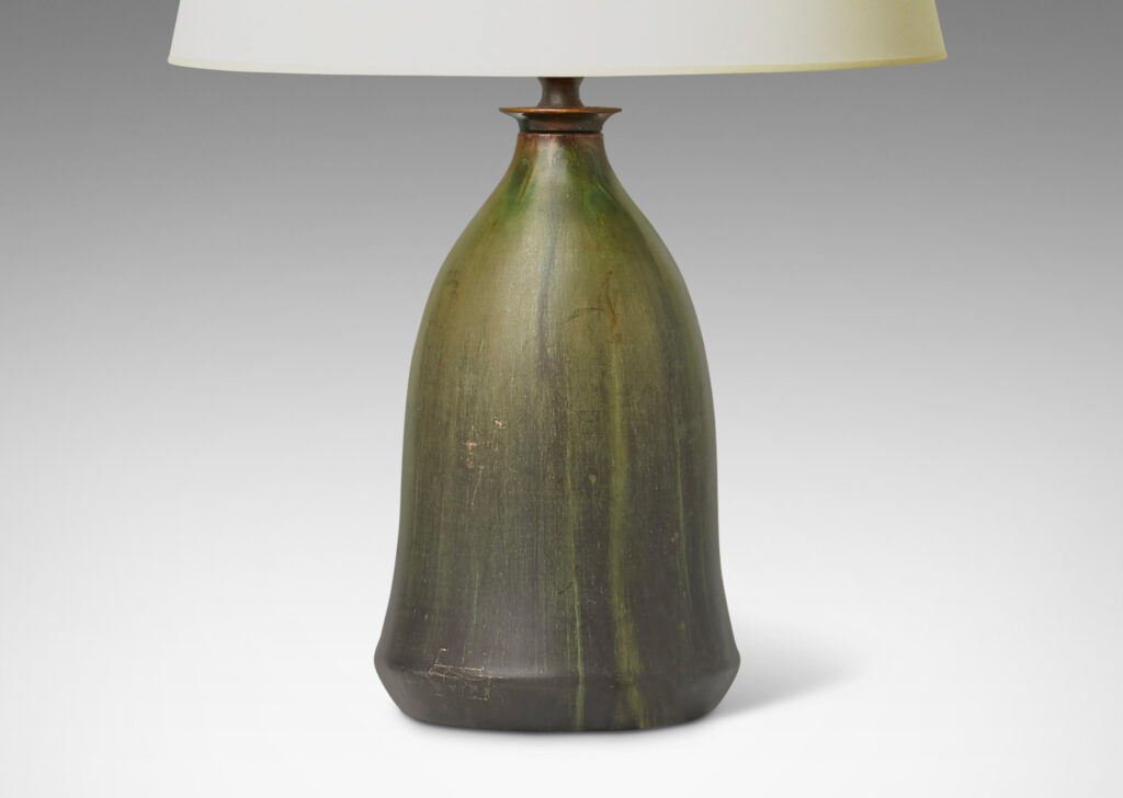 Gallery BAC flaring bell form with a magnificently executed flowing olive and dark green glaze and bronze mount with filigree