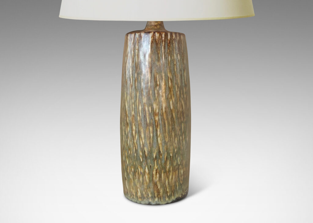 Gallery BAC tall swelling column forms with carved rustic texture and flowing brown glaze