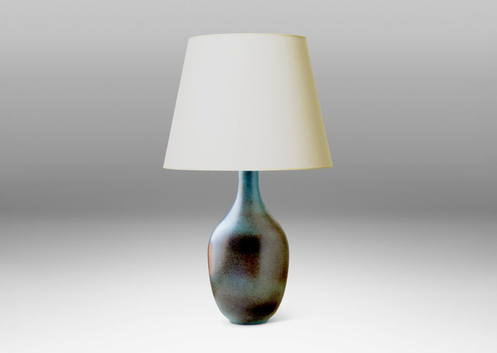 Gallery BAC tapered ovoid body with attenuated neck and reveal foot, crafted in stoneware glazed in an atmospherically applied gray over a cornflower blue