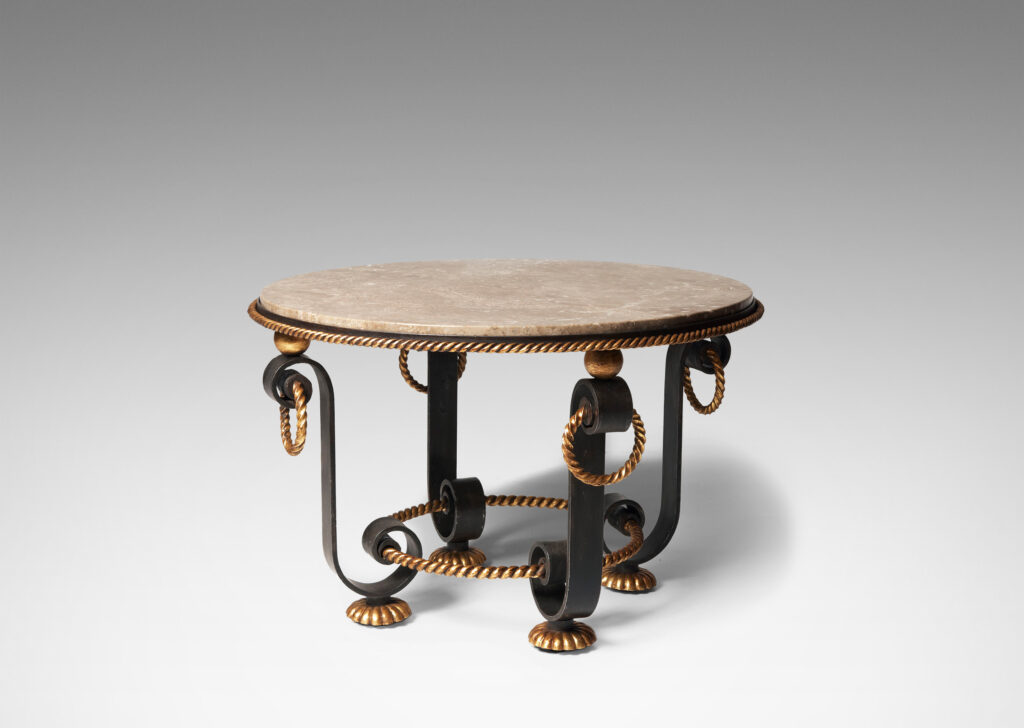 Gallery BAC base of scrolling forms with twisted rope detailing, hanging rings and spheres in in painted and gilt iron withoriginal Napoleon marble top