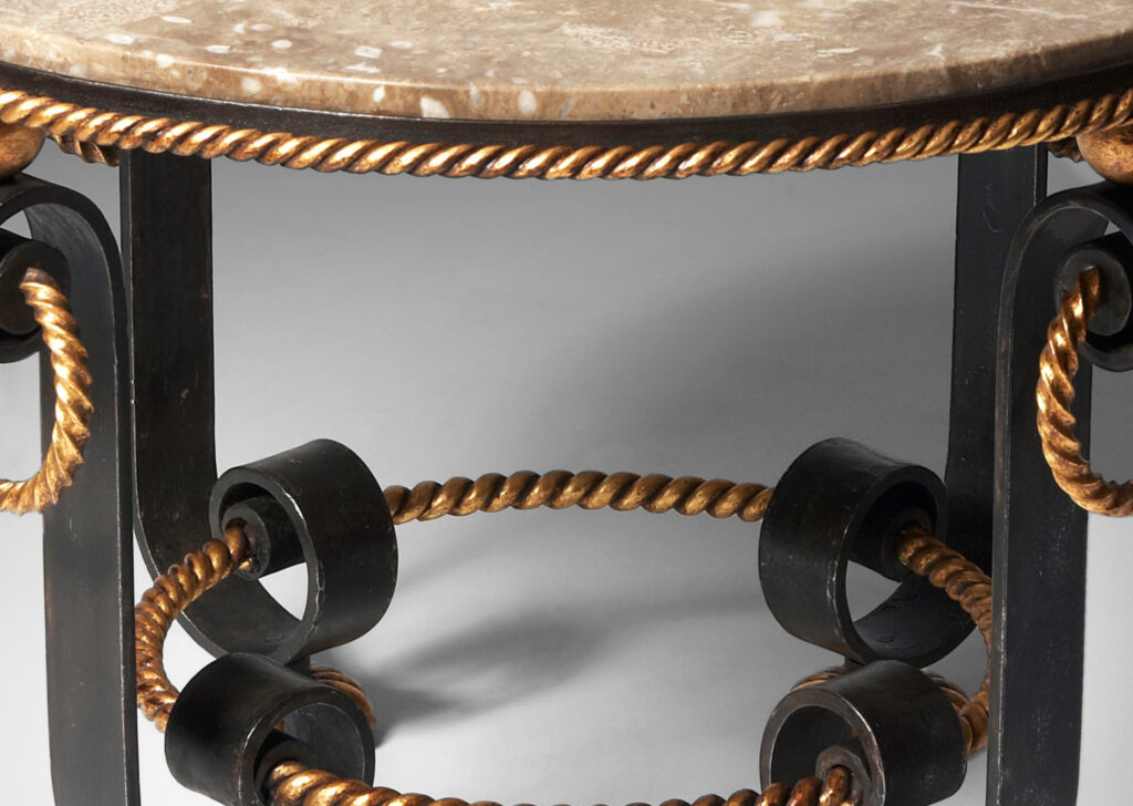 Gallery BAC base of scrolling forms with twisted rope detailing, hanging rings and spheres in in painted and gilt iron withoriginal Napoleon marble top