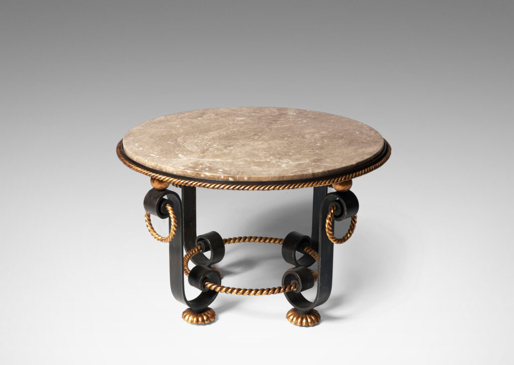 Gallery BAC base of scrolling forms with twisted rope detailing, hanging rings and spheres in in painted and gilt iron withoriginal Napoleon marble top