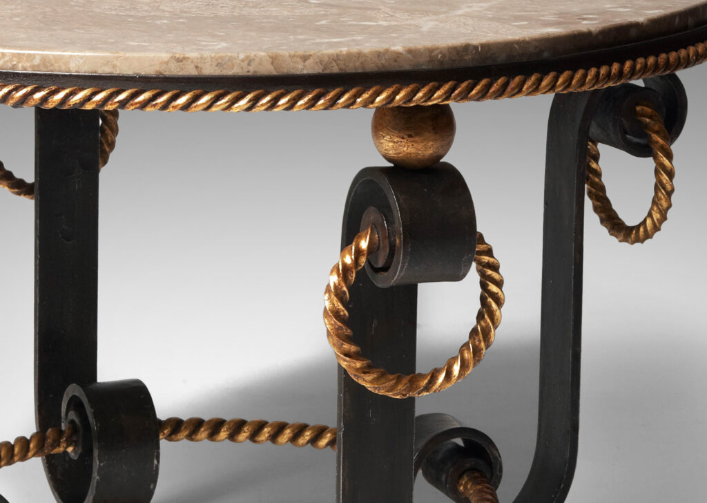 Gallery BAC base of scrolling forms with twisted rope detailing, hanging rings and spheres in in painted and gilt iron withoriginal Napoleon marble top