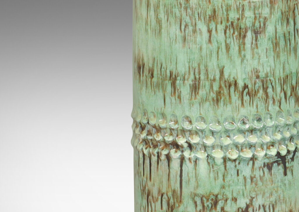 Gallery BAC cylindrical form with carved band detail, glazed in a pale celadon-black