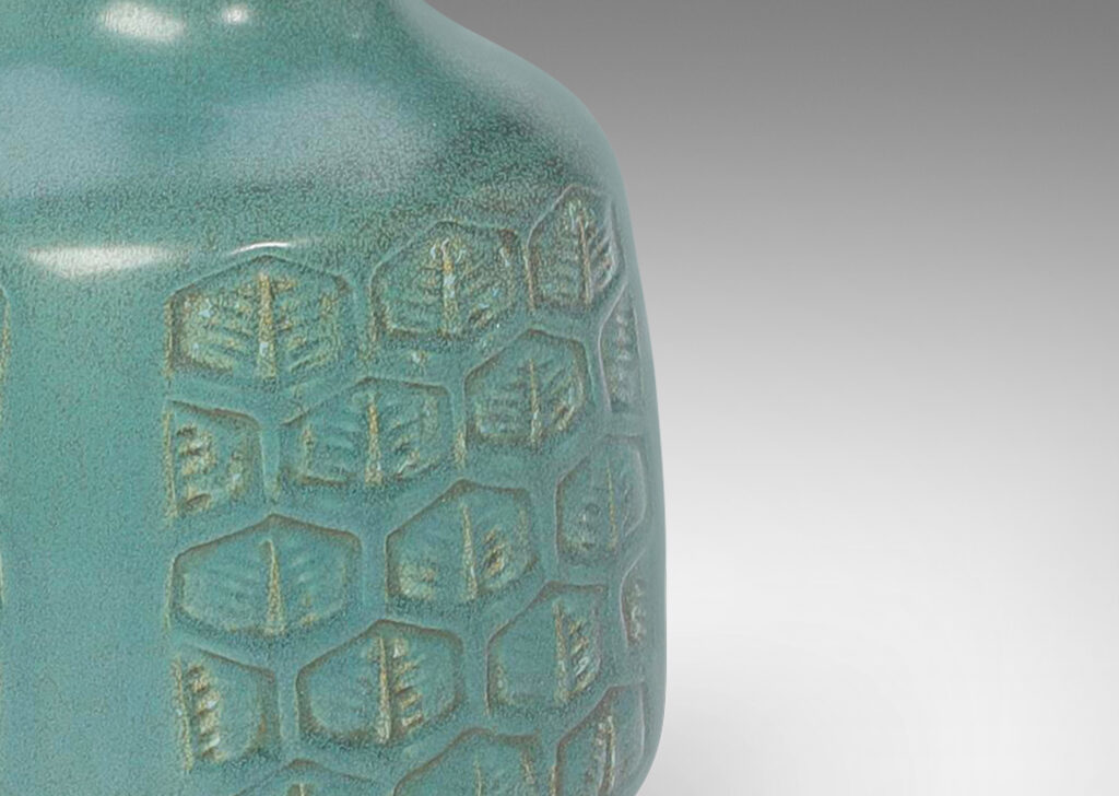 Gallery BAC squared drum form ornamented with hexagonal foliate motifs, and a tall sprouting neck, glazed in turquoise with gray speckles