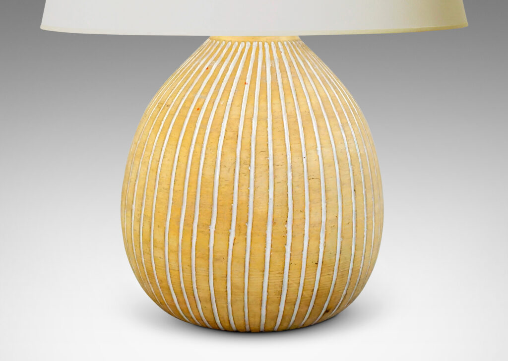 Gallery BAC bulbous forms in an unglazed sandy tone, with carved vertical pinstripes glazed gloss white