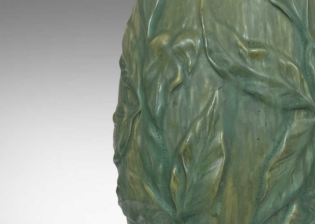 Gallery BAC tall drop form draped in delicate relief foliage glazed a soft green, mounted on a stepped base