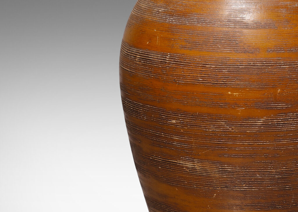 Gallery BAC tall cactus-like tapered ovoid form with carved ridges and a wood brown glaze