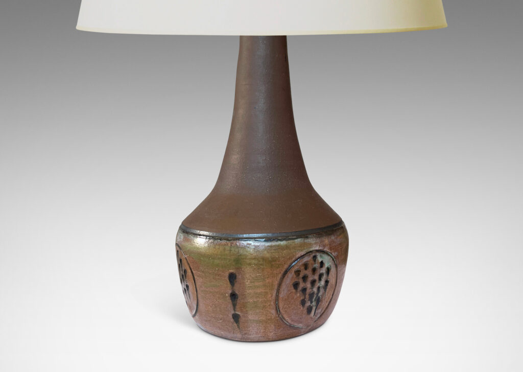 Gallery BAC drum form with carved geometric decorations and a conical neck, glazed in matte brown and eggshell finish taupe and brown