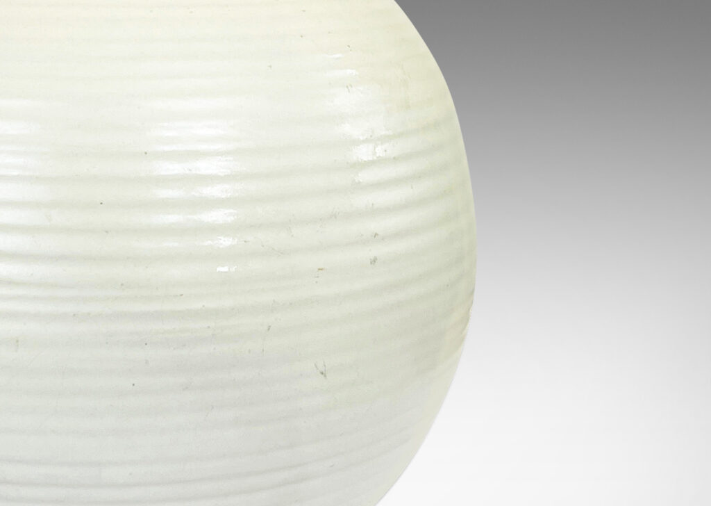 Gallery BAC plump globe forms with horizontal ridges, glazed in an eggshell finish ivory