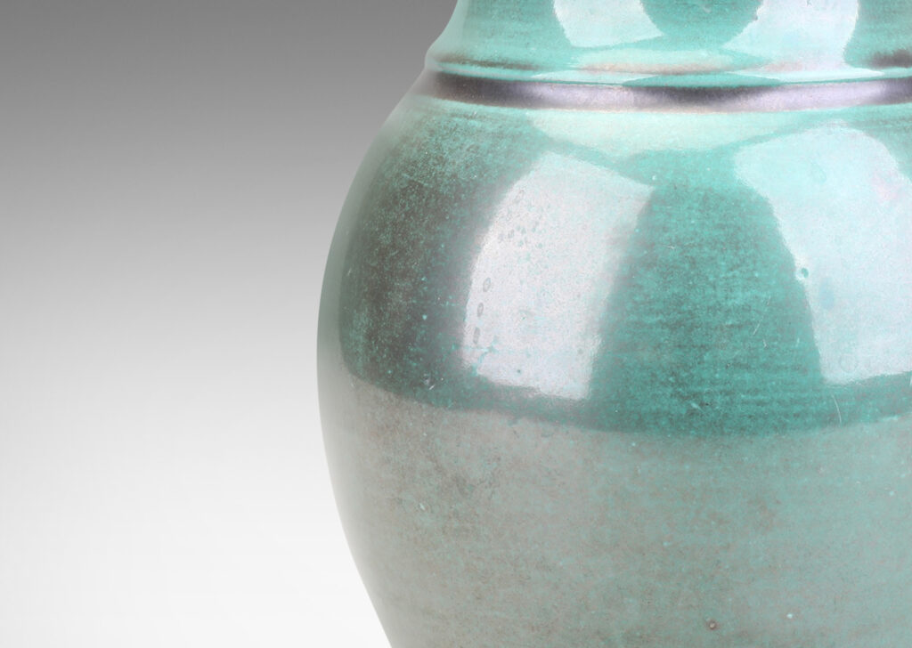 Gallery BAC undulating form with wide mouth, in a teal and gunmetal luster copper oxide glaze