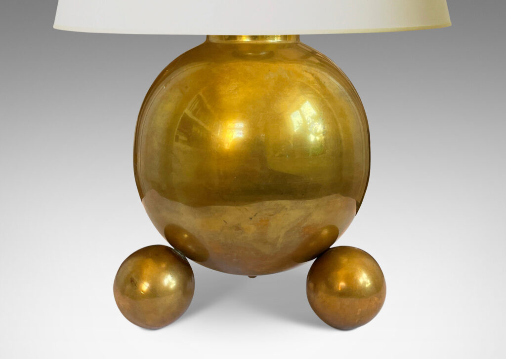 Gallery BAC globe forms perched on trios of smaller spheres; brass