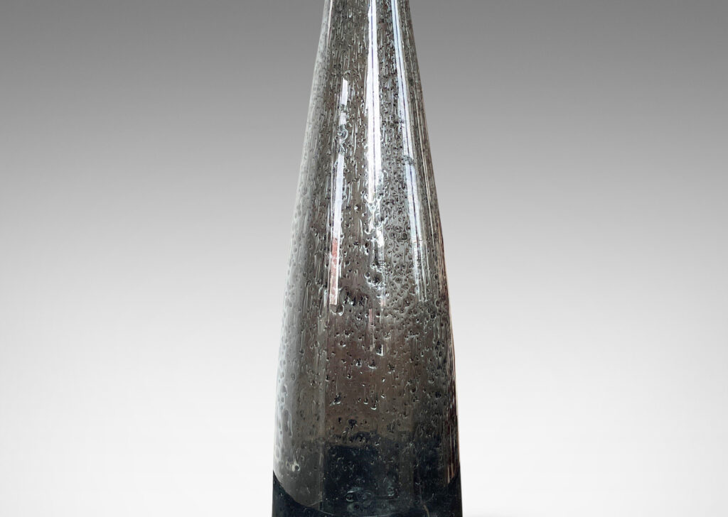 Gallery BAC having tall conical forms in hand-blown dark gray glass