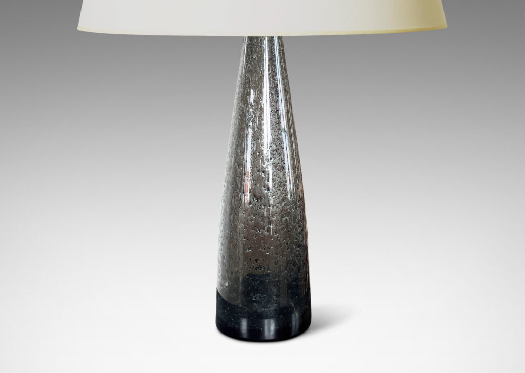 Gallery BAC having tall conical forms in hand-blown dark gray glass