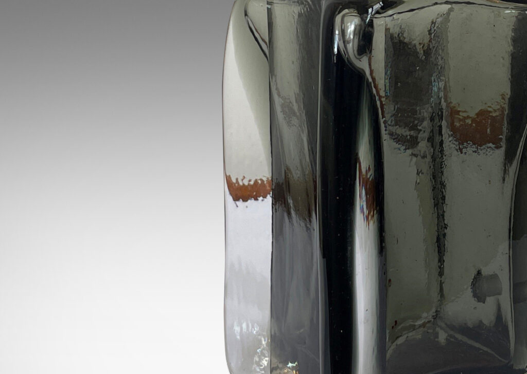 Gallery BAC square bottle forms with corner fins, in hand-blown gray within clear glass