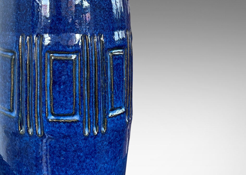 Gallery BAC tall organically modeled form with wide band of carved geometrics, glazed in a richly saturated blue