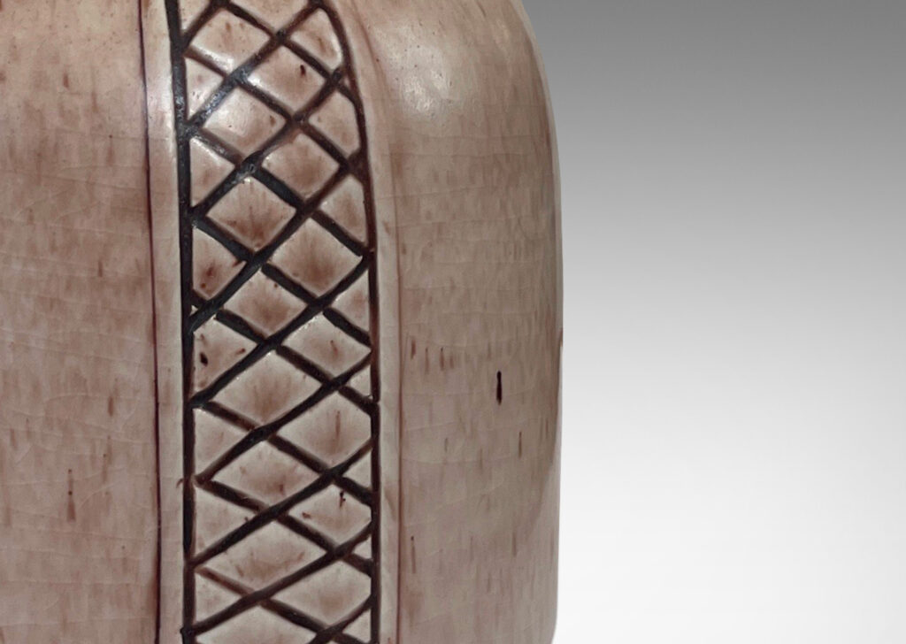 Gallery BAC drum forms ornamented with diamond lattice stripes, glazed in a light brown wash