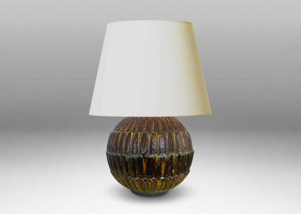 Gallery BAC globe form with rows of rectangular blocks in relief, glazed in a rare dark brown tone