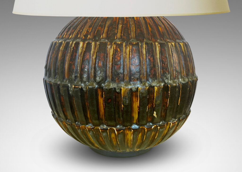 Gallery BAC globe form with rows of rectangular blocks in relief, glazed in a rare dark brown tone