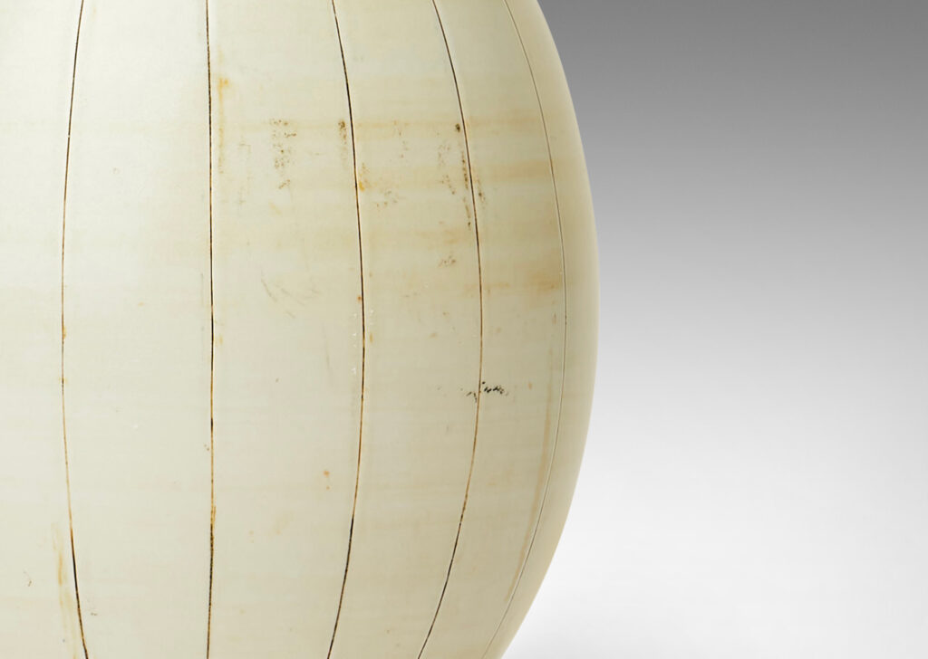 Gallery BAC arge ovoid form with carved meridians, glazed in ivory with light brown accents