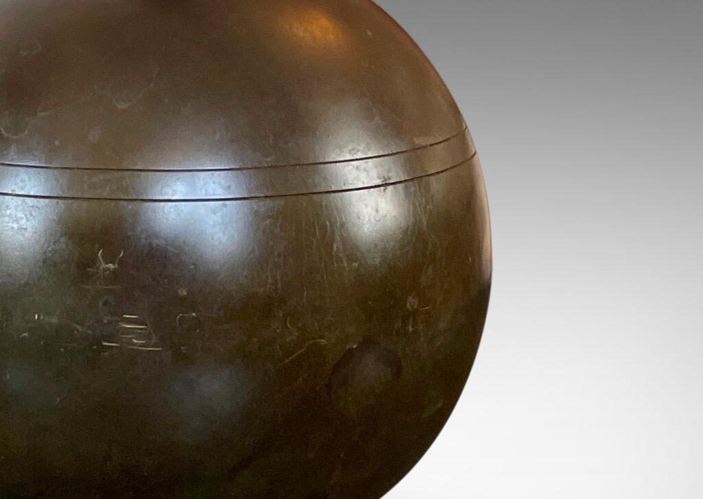 Gallery BAC globe form with coved neck and pinstripe details; patinated cast bronze