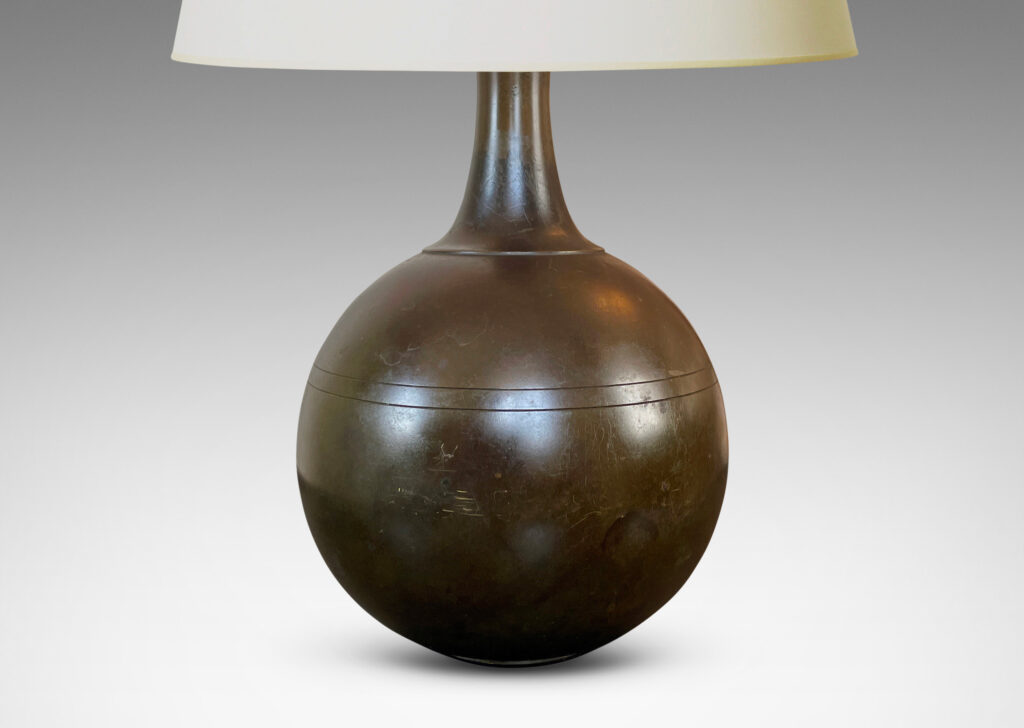 Gallery BAC globe form with coved neck and pinstripe details; patinated cast bronze